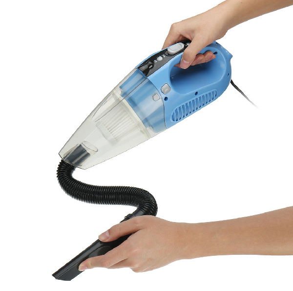 hands holding a small blue hand wet-dry vacuum cleaner with a hose