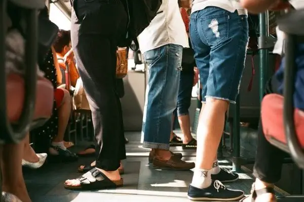 people standing in a crowded subway