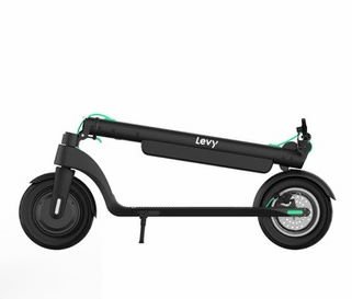 side view of a folded Levy Plus electric scooter with green finishing touches in design