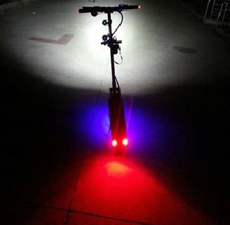 electric scooter with different lights in many colors, all turned on