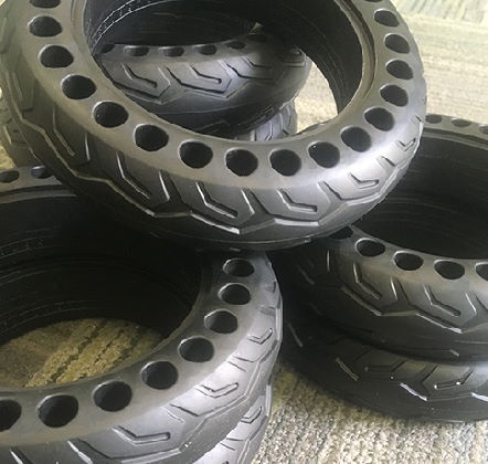 several sets of solid honeycomb tires with holes in them for better ride quality