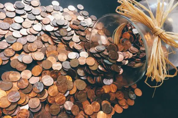 many coins spilled over from a jar