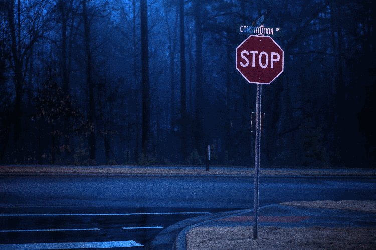 stop sign on an empty road