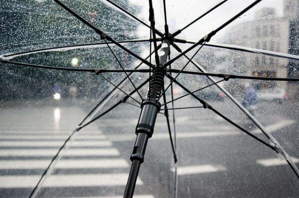 transparent umbrella protecting from water and rain