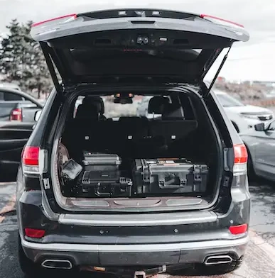 A car trunk filled with luggage