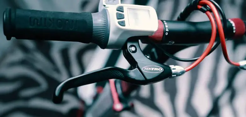 A close up of an electric scooter brake lever