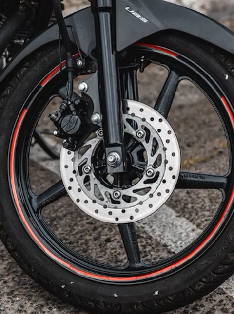 A closeup of an electric scooter's hydraulic brakes with an ABS system