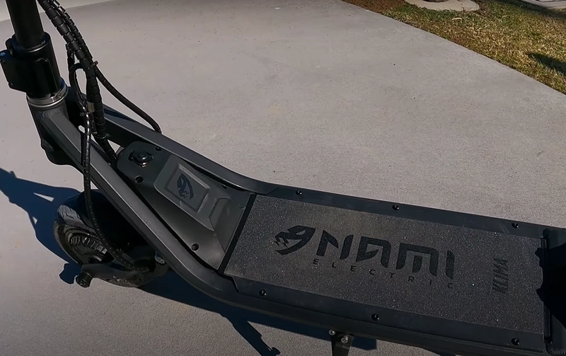 A closeup of the deck of the Nami Klima electric scooter