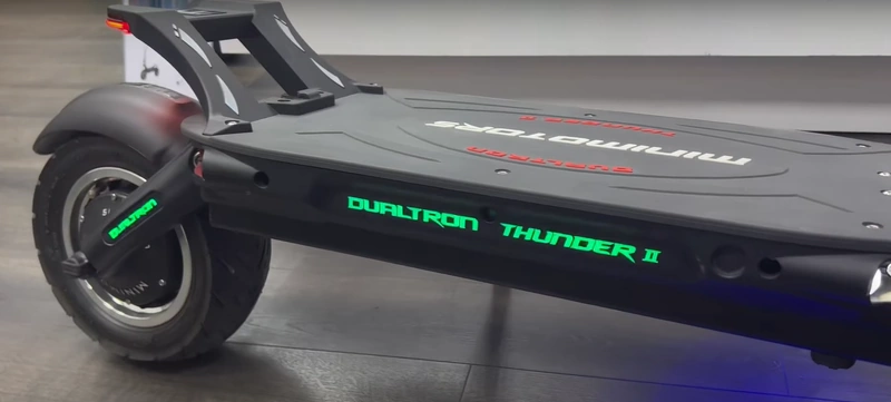 A closeup of the rear tire, rear footrest, and deck of the Dualtron Thunder 2