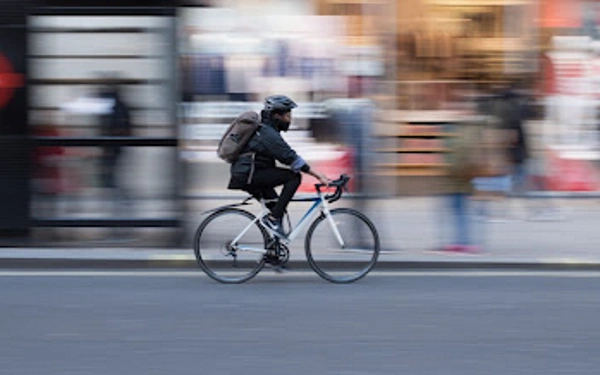 A person riding an electric bike in fast speed