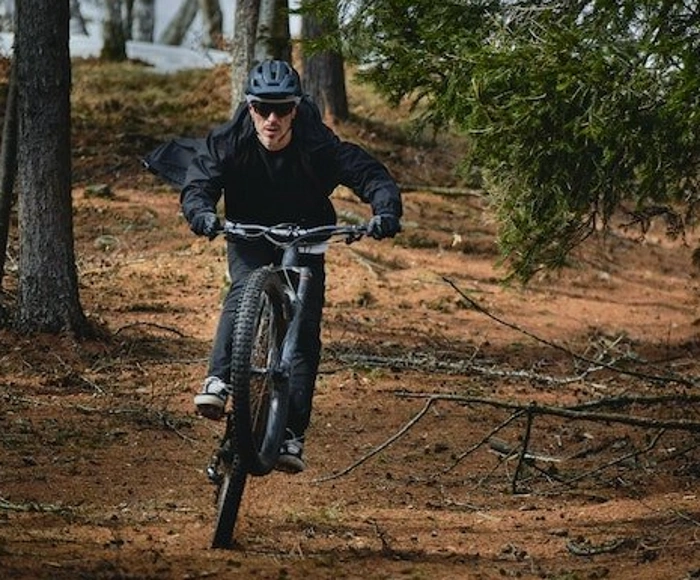 A person riding an electric bike in the mountains
