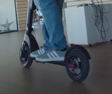 person riding the Turboant X7 Pro indoors