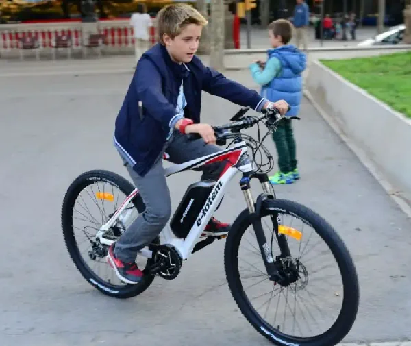 a kid riding an electric bike