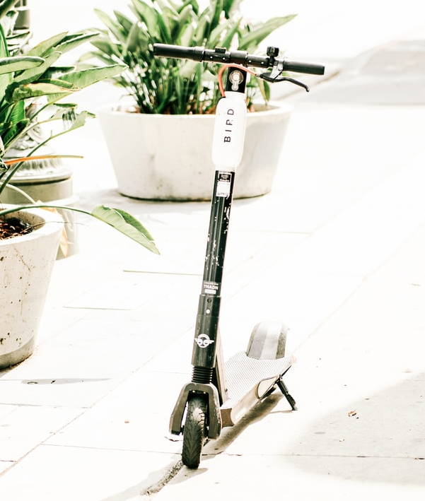 Bird electric scooter leaning on its kickstand