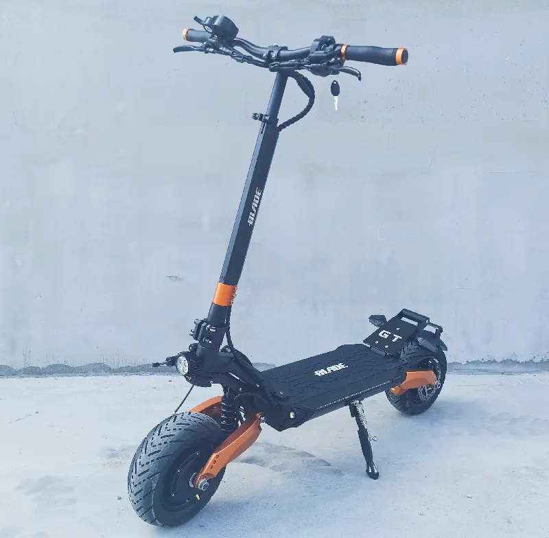 side diagonal view of a black Blade GT+ electric scooter with orange details
