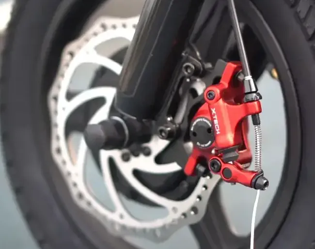 closeup of hydraulic brakes of an electric scooter