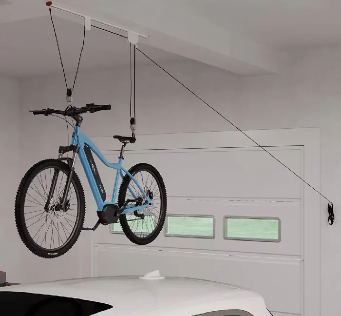 electric bike hanging from a hook in a garage