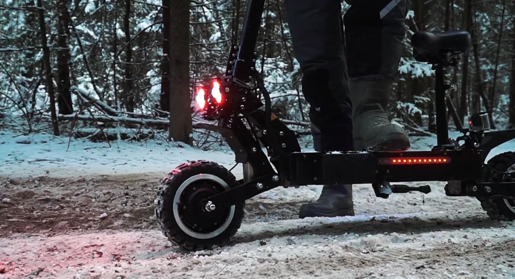 electric scooter with turned on lights.