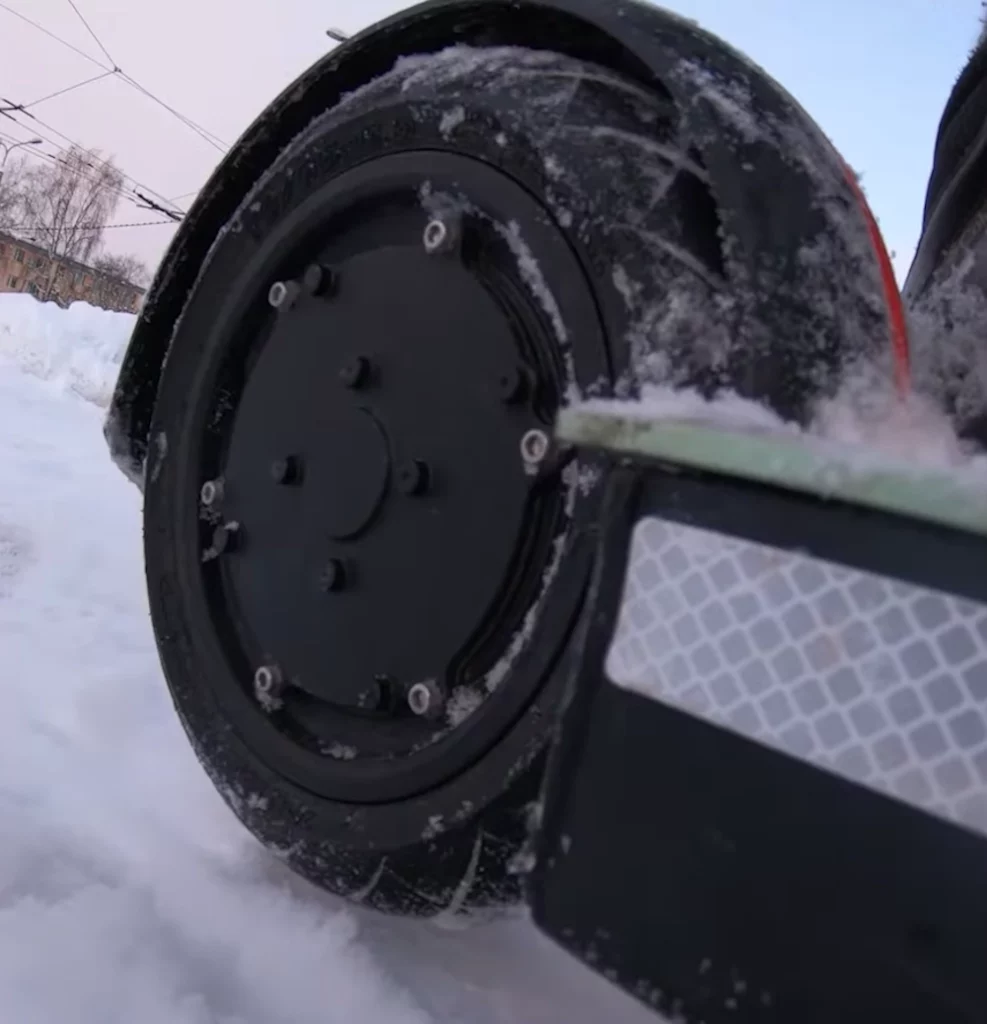 electric scooter tire on snow.