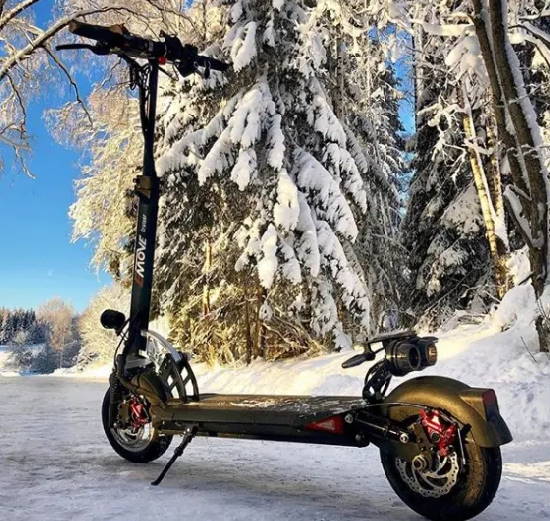 an EMove Cruiser electric scooter in a winter setting