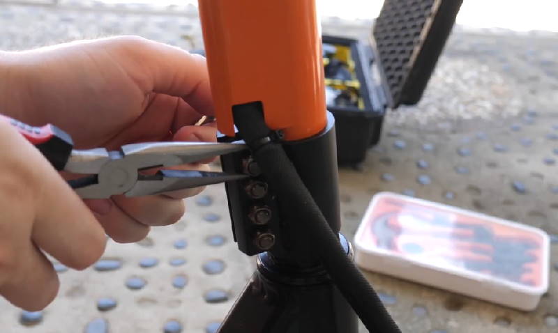 maintenance for the EMove Touring, tightening screws with a plier