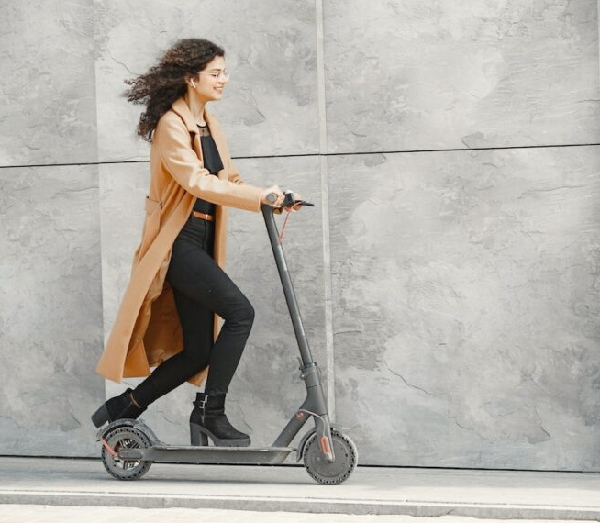 girl riding an electric scooter as exercise