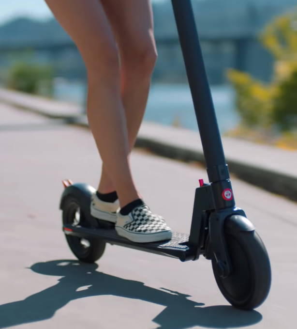 lower part of the GoTrax GXL Commuter and a person riding it