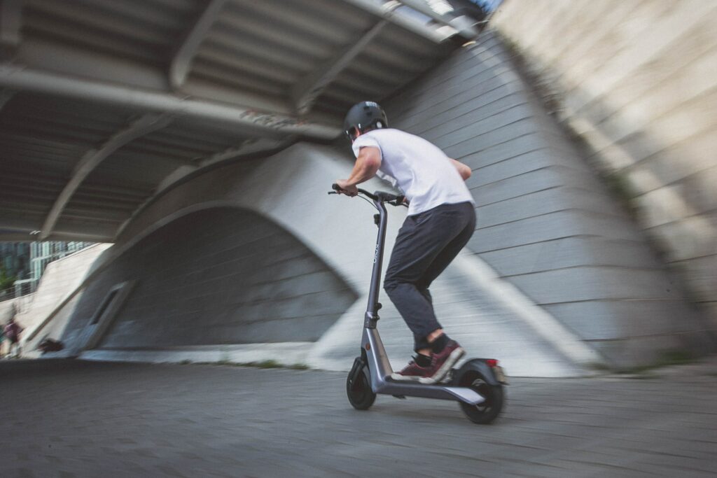 guy on a scooter riding very fast