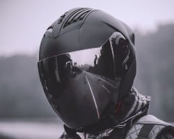 Person wearing a full motorcycle helmet