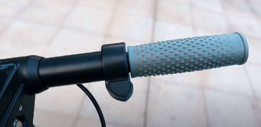 thumb throttle button on the right handlebar of a Kugoo M2 Pro