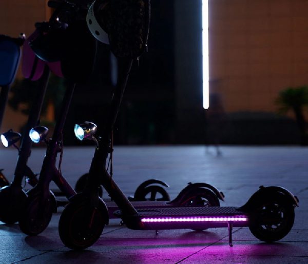 LED light strip on the side of an electric scooter deck