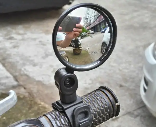 round mirror insatlled on an electric scooter handlebar