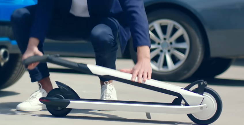 person folding the Ninebot Air T15