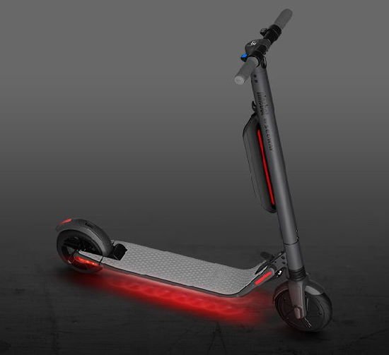 diagonal view of Ninebot ES4 electric scooter on a black-grey background