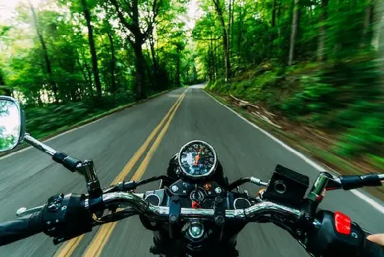 person riding a motorcycle at a high speed