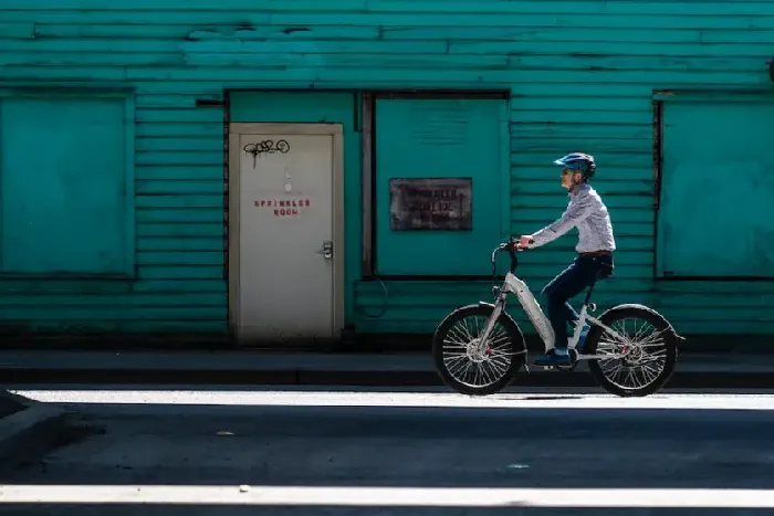 person riding an electric bike manually without the battery