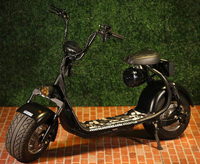 side view of a Phatty 3G electric scooter in a garden