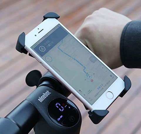 electric scooter phone holder installed on a handlebar with a phone in it