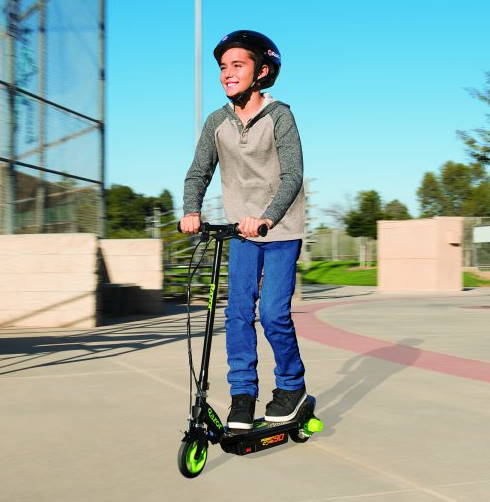 child with a helmet riding a Razor Power Core E90