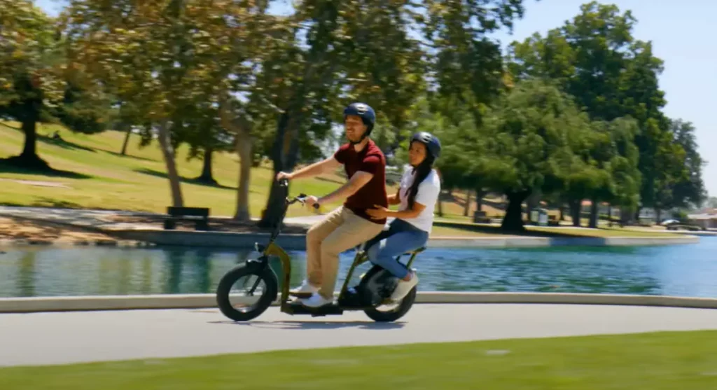 razor two seated electric scooter in a park