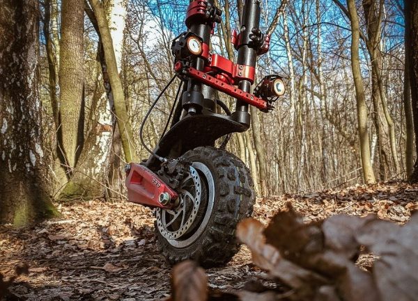 front of Techlife X9 electric scooter on a rough terrain in forrest