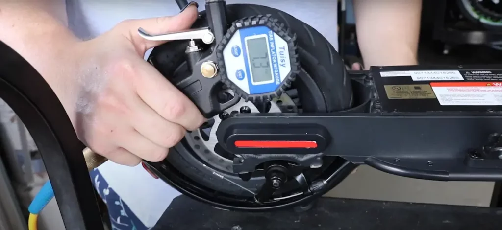 using a tire pressure gauge