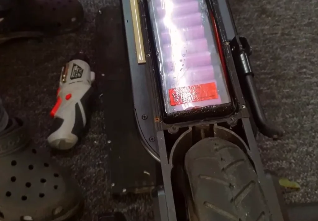 water in the battery compartment of an electric scooter.
