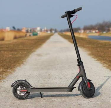 Xiaomi M365 standing on a road