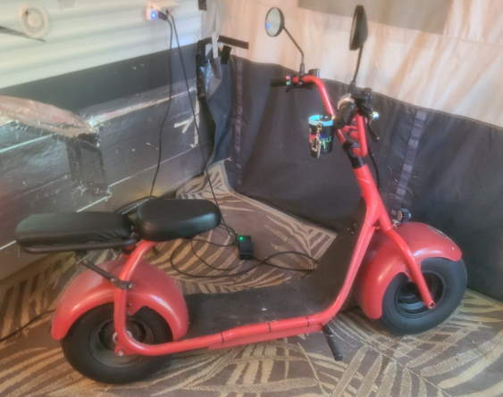 side view of a red Zoomers fat tire electric scooter
